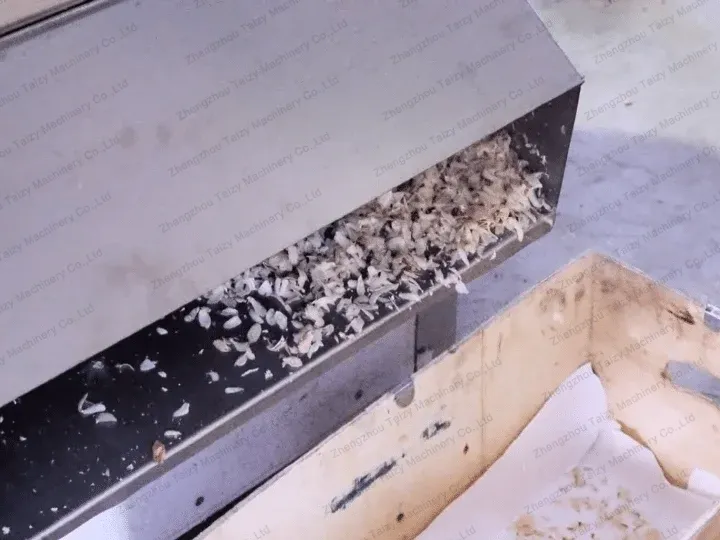 discharge port of almond slicer